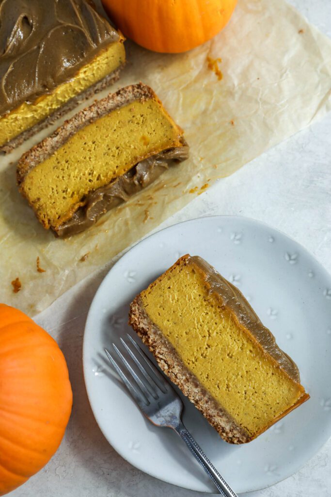 slices of Pumpkin Pie Cheesecake with SunButter Frosting on plate with fork