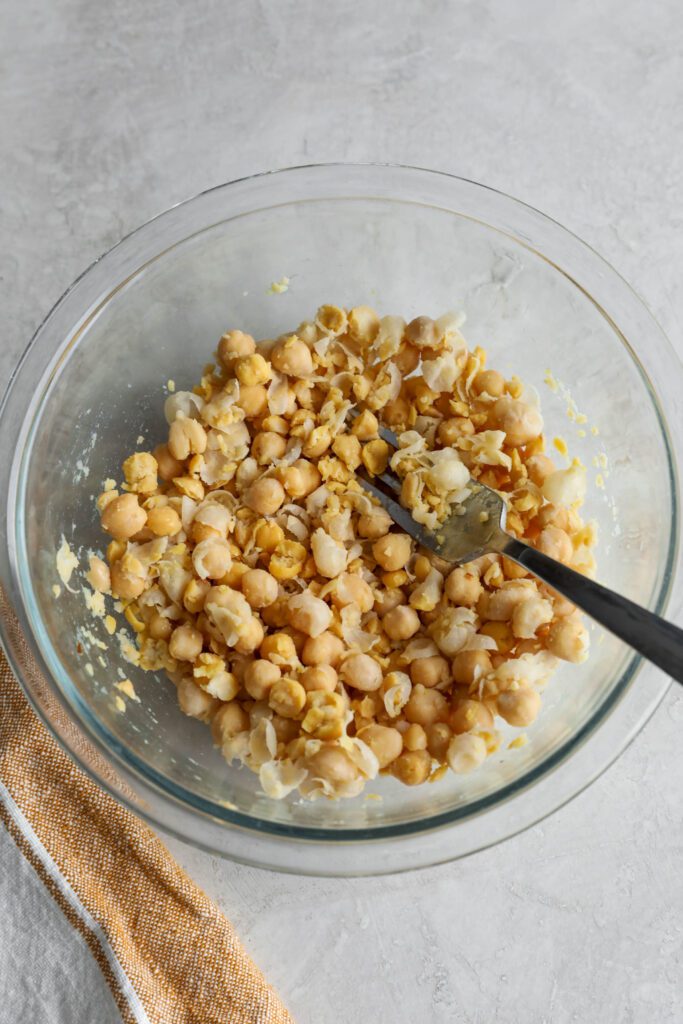 chickpeas smashed in bowl with fork