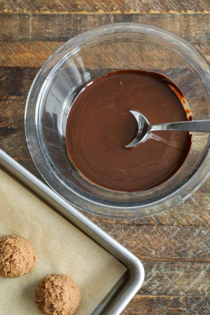 dark chocolate melted in bowl with spoon 