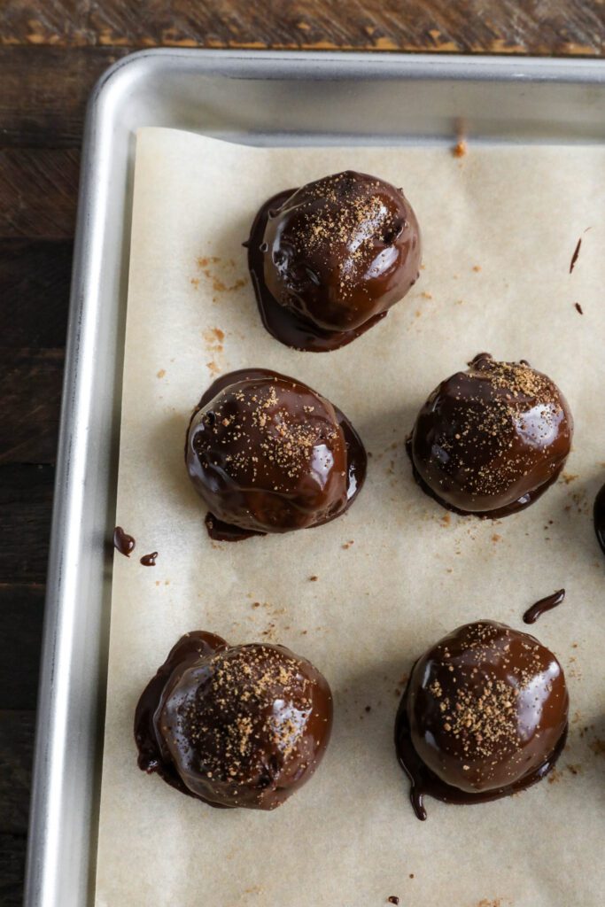 Apple Butter Truffles on parchment lined cookie sheet
