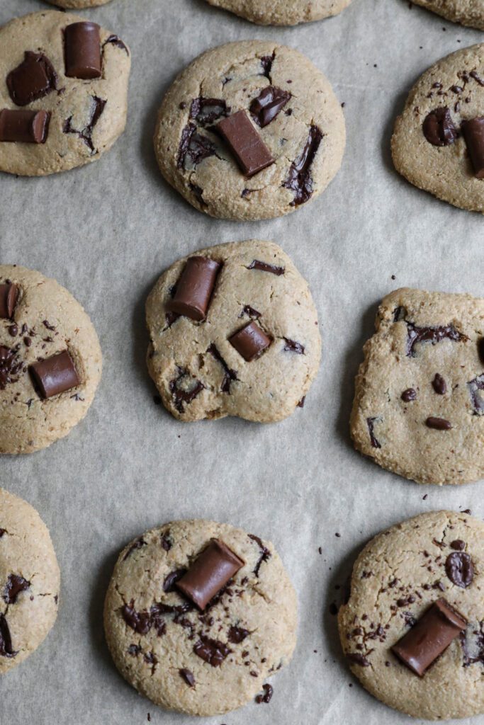 SunButter Chocolate Chip Cookies baked on parchment lined baking sheet