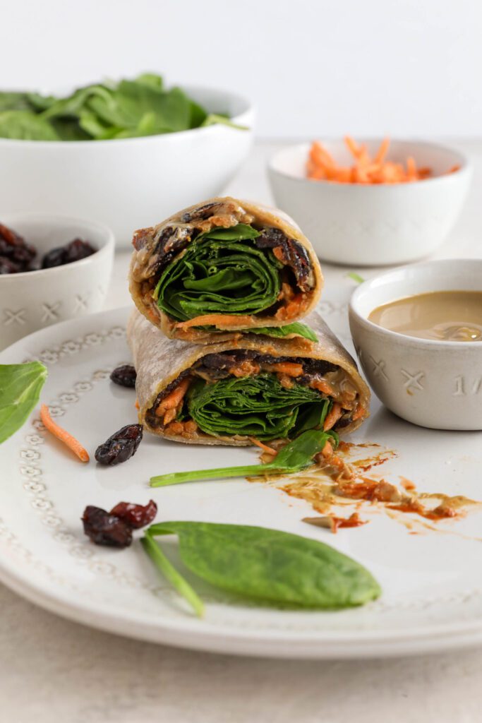 Sweet & Spicy SunButter Spinach Wrap halved and stacked on plate