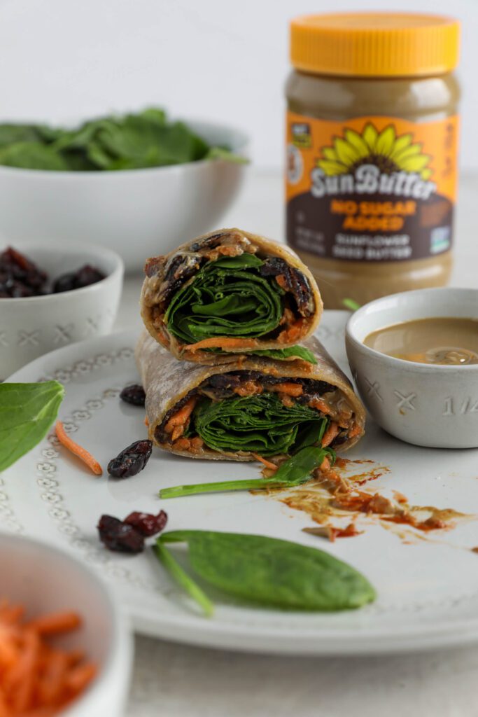 Sweet & Spicy SunButter Spinach Wrap halved and stacked on plate