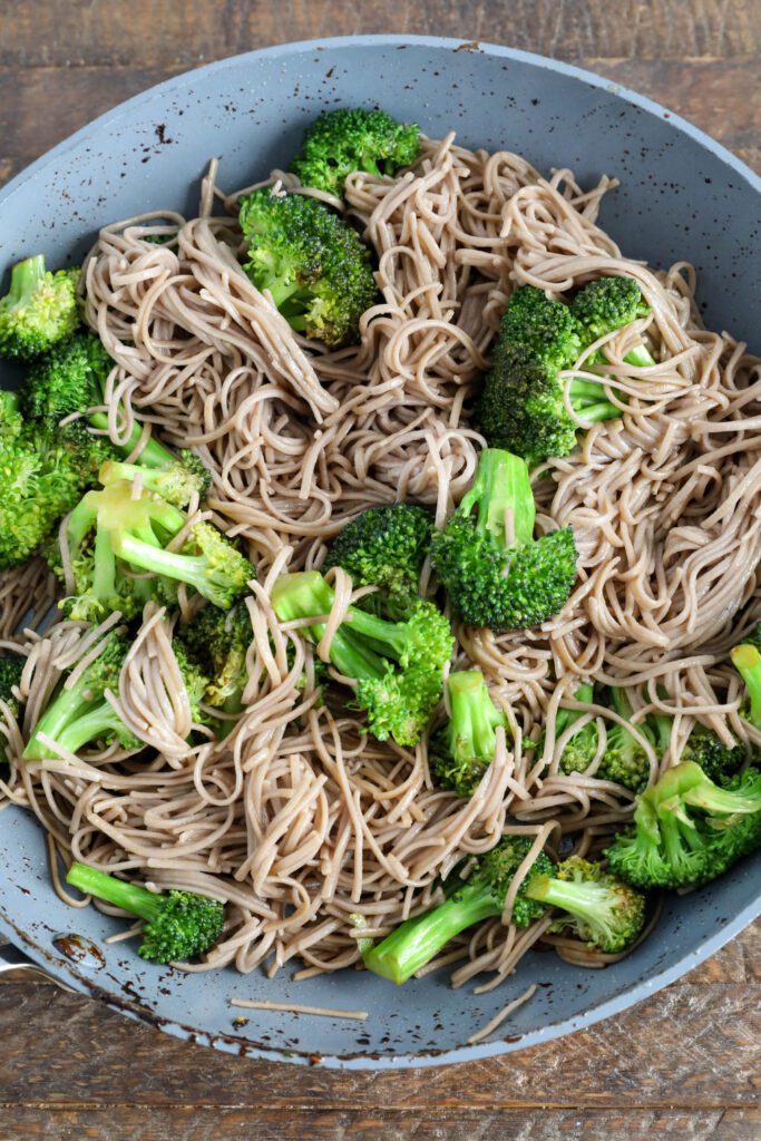 broccoli and soba noodles in pan