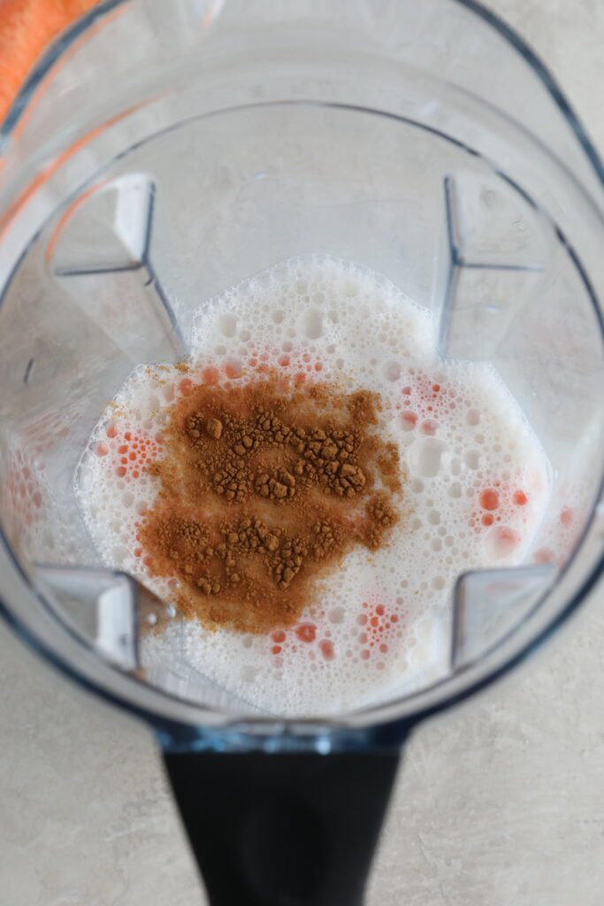 almond milk, carrots, and cinnamon in blender