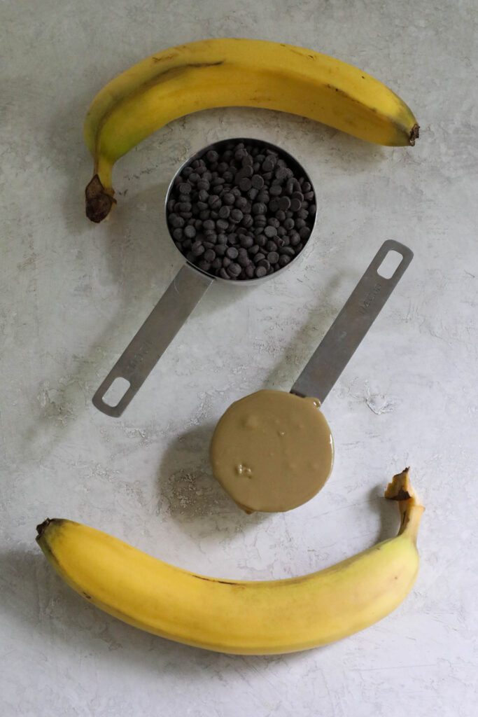 two bananas, 1/2 cup of chocolate chips, and 1/4 cup of SunButter